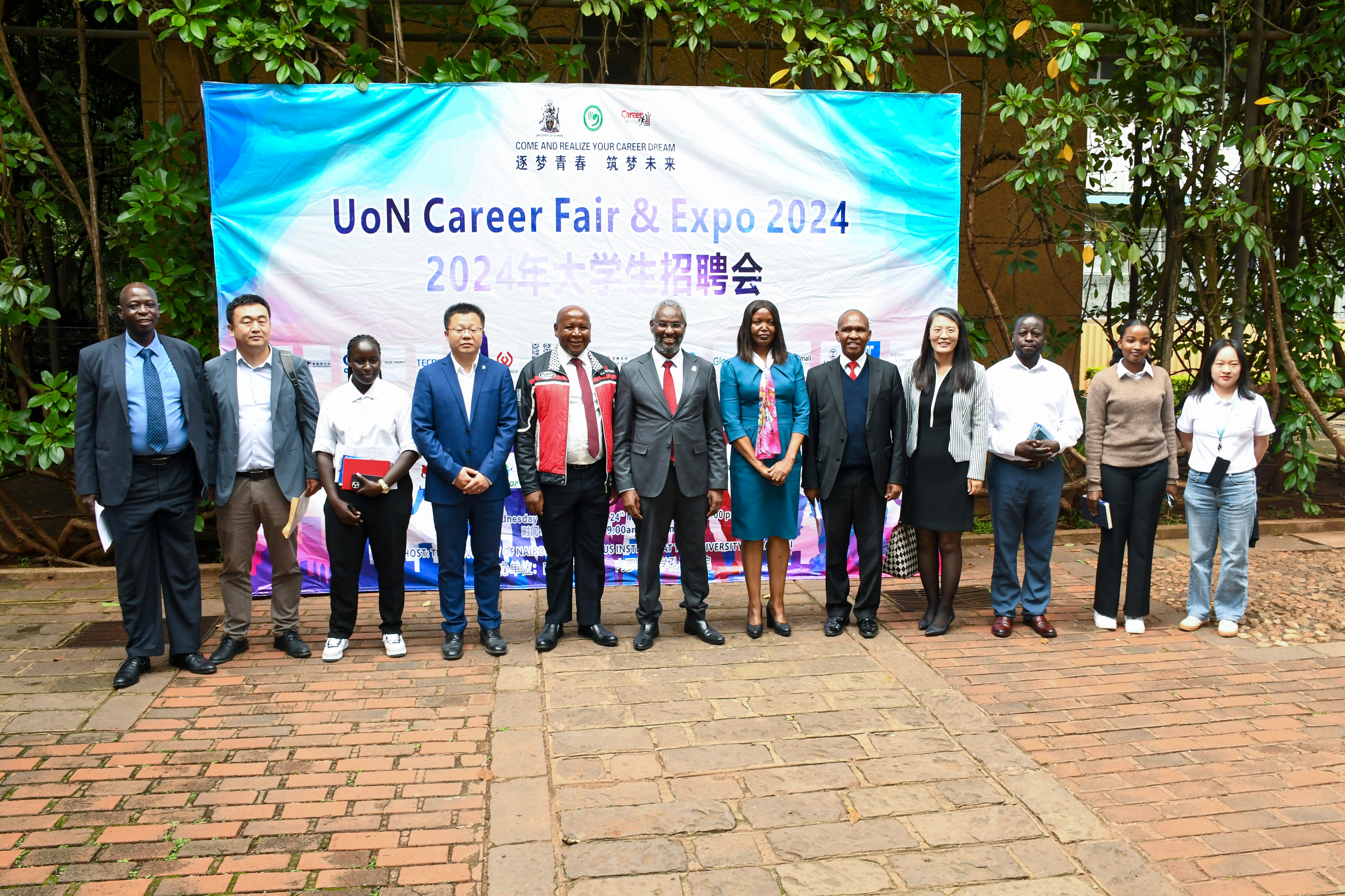 Partners posing for a photo with the Vice Chancellor Prof. Kiama, Director Corporate Affairs Mr. John Orindi, Dean of Students, Mr. Johnson Ireri Kinyua, Director Confucius Institute Prof. Wang and other guests 