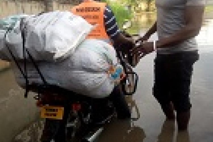 Magero going into flooded homes to distribute food